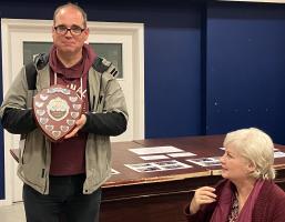 Leah Herrings' father receives shield from Elaine Moorey A